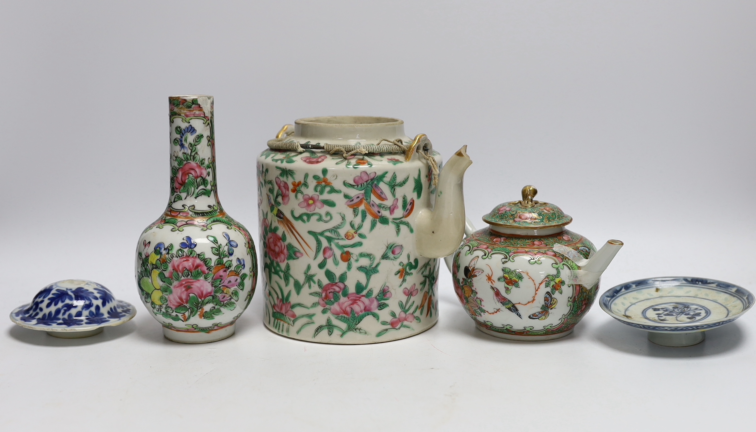 A collection of Chinese and Japanese ceramics including two famille rose teapots, a vase, four saucers, etc. (8)